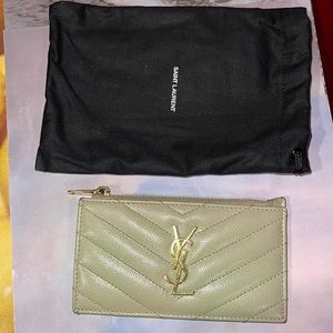 YSL leather card holder with gold hardware in light tan / good + fair condition